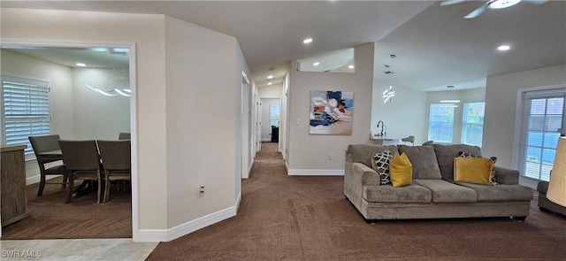 1948 Redmont Ave, Lehigh Acres, FL 33972 - carpeted living area featuring vaulted ceiling, ceiling fan, and recessed lighting