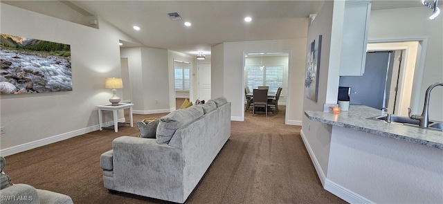 1948 Redmont Ave, Lehigh Acres, FL 33972 - living room with recessed lighting, dark colored carpet, vaulted ceiling, and baseboards