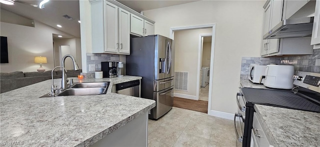 1948 Redmont Ave, Lehigh Acres, FL 33972 - kitchen featuring ventilation hood, stainless steel appliances, a sink, backsplash, and recessed lighting