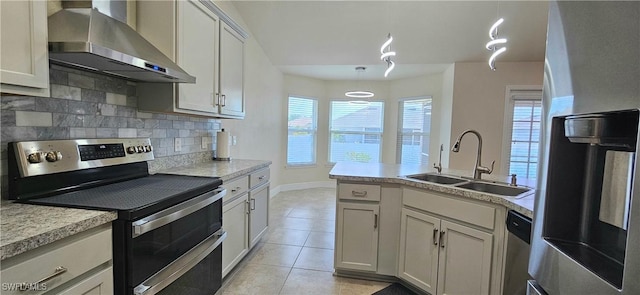 1948 Redmont Ave, Lehigh Acres, FL 33972 - kitchen with stainless steel appliances, wall chimney range hood, a sink, light tile patterned floors, and decorative backsplash