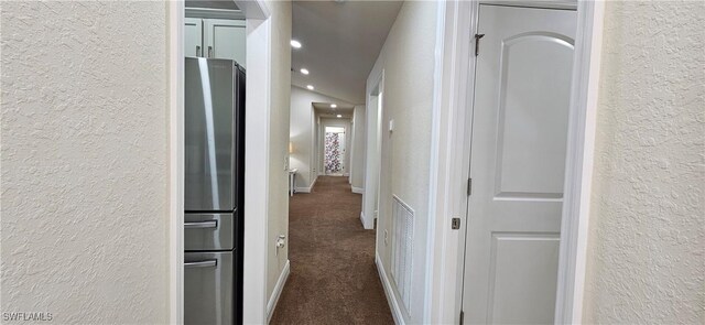 1948 Redmont Ave, Lehigh Acres, FL 33972 - hallway featuring a textured wall, dark carpet, recessed lighting, and baseboards