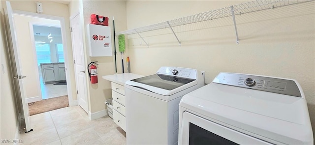 1948 Redmont Ave, Lehigh Acres, FL 33972 - laundry room featuring separate washer and dryer and light tile patterned flooring