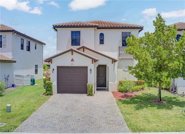 5461 Soria Ave, Ave Maria, FL 34142 - mediterranean / spanish-style home with a tiled roof, stucco siding, decorative driveway, and a front lawn