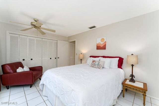 bedroom featuring light tile patterned flooring, ceiling fan, and baseboards