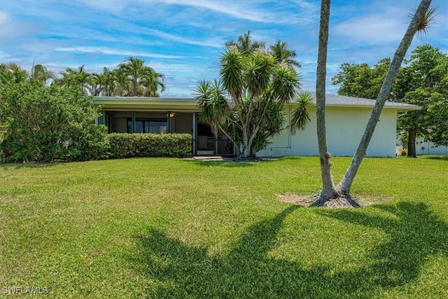 116 Short Ct, Naples, FL 34112 - view of front of house featuring a front lawn and stucco siding