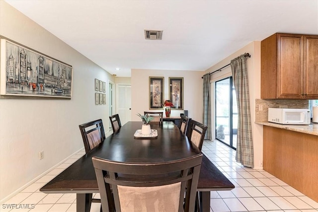 116 Short Ct, Naples, FL 34112 - dining space with light tile patterned floors