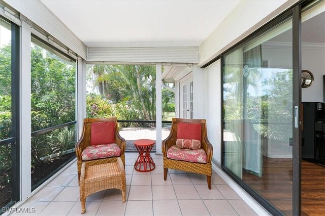 116 Short Ct, Naples, FL 34112 - sunroom featuring tile patterned floors
