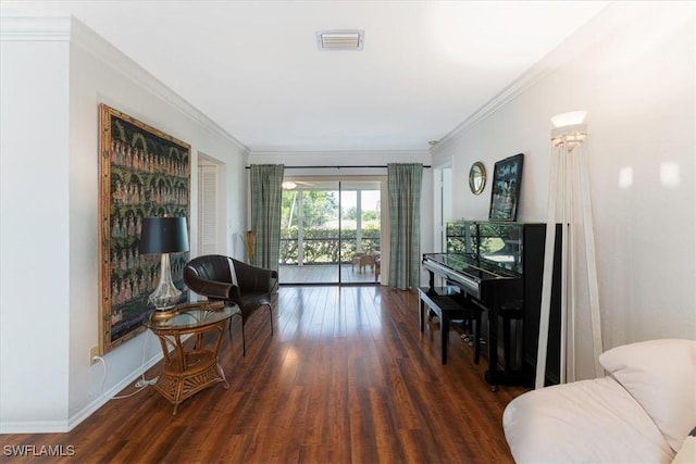 sitting room featuring wood finished floors and ornamental molding
