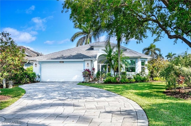 816 Mount Hood Ct, Naples, FL 34104 - ranch-style home featuring an attached garage, stucco siding, a front yard, and driveway