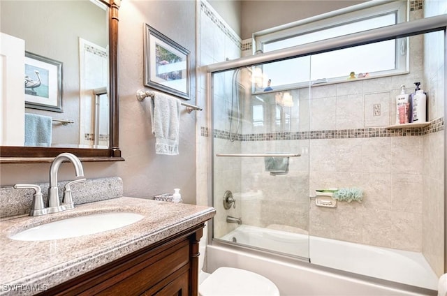 816 Mount Hood Ct, Naples, FL 34104 - bathroom with shower / bath combination with glass door, vanity, and toilet
