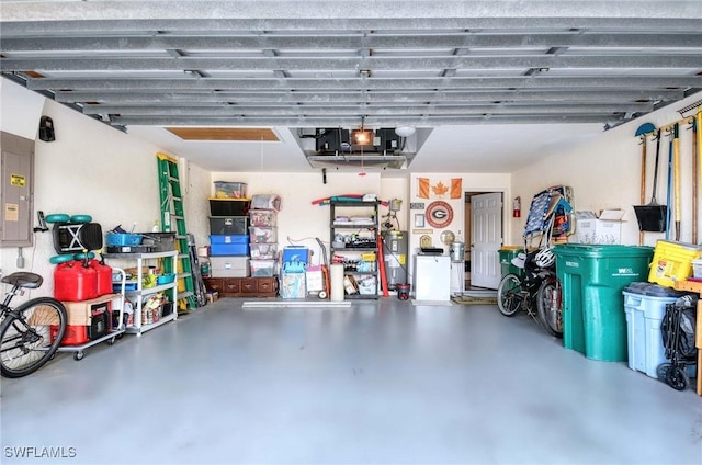 816 Mount Hood Ct, Naples, FL 34104 - garage featuring electric panel and electric water heater