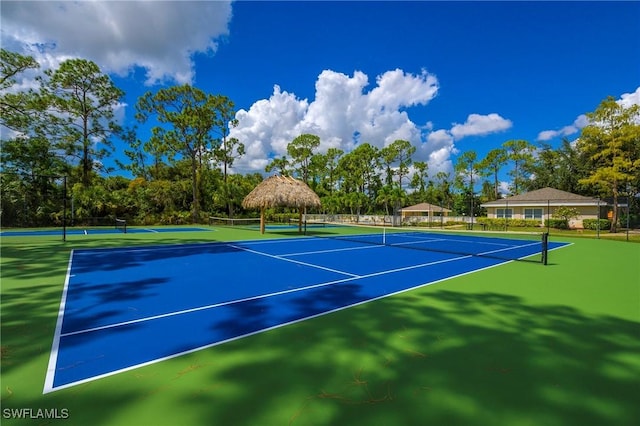 816 Mount Hood Ct, Naples, FL 34104 - view of tennis court with a gazebo and fence