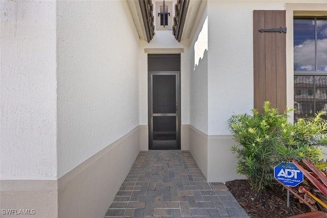 5692 Cassidy Ln, Ave Maria, FL 34142 - view of exterior entry featuring stucco siding