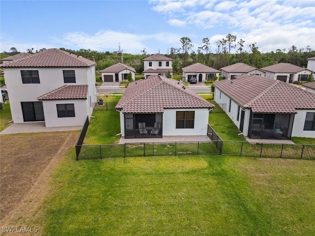 5692 Cassidy Ln, Ave Maria, FL 34142 - rear view of house featuring a sunroom, a residential view, and stucco siding