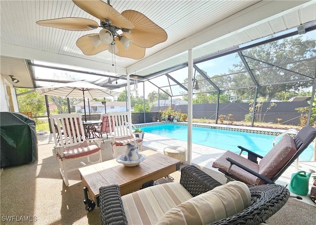 9157 Tangelo Blvd, Fort Myers, FL 33967 - view of swimming pool with a patio, a fenced backyard, a lanai, an outdoor hangout area, and a grill