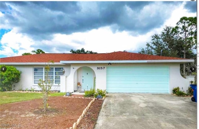 9157 Tangelo Blvd, Fort Myers, FL 33967 - single story home featuring stucco siding, concrete driveway, and an attached garage