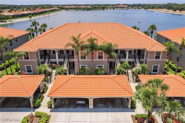 aerial perspective of suburban area featuring a nearby body of water