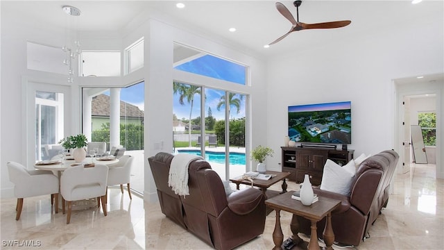 3936 Deep Passage Way, Naples, FL 34109 - living room with a towering ceiling, recessed lighting, a ceiling fan, and light marble finish floors