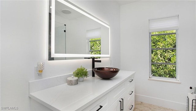 3936 Deep Passage Way, Naples, FL 34109 - bathroom featuring vanity and baseboards