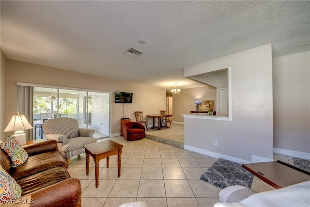 7232 Saint Anns Ct, Fort Myers, FL 33908 - living room featuring a chandelier, light tile patterned floors, a textured ceiling, and baseboards