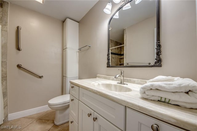 7232 Saint Anns Ct, Fort Myers, FL 33908 - bathroom featuring a tile shower, toilet, baseboards, vanity, and tile patterned flooring
