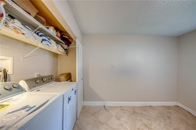 7232 Saint Anns Ct, Fort Myers, FL 33908 - clothes washing area featuring separate washer and dryer, baseboards, and a textured ceiling