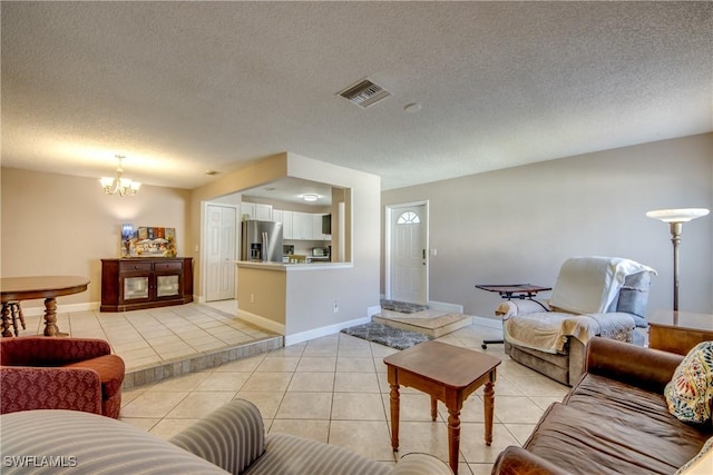 7232 Saint Anns Ct, Fort Myers, FL 33908 - living area featuring a chandelier, light tile patterned floors, a textured ceiling, and baseboards