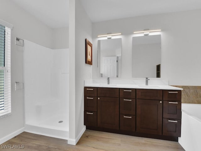 3521 SE Santa Barbara Pl, Cape Coral, FL 33914 - full bath featuring wood finished floors, baseboards, plenty of natural light, and walk in shower