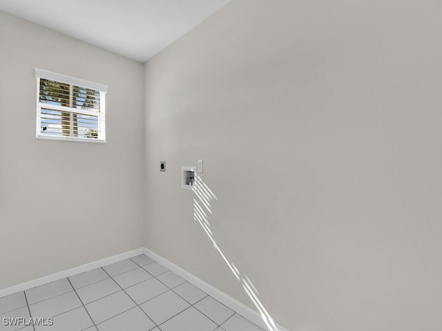 3521 SE Santa Barbara Pl, Cape Coral, FL 33914 - clothes washing area with electric dryer hookup, washer hookup, baseboards, and light tile patterned floors
