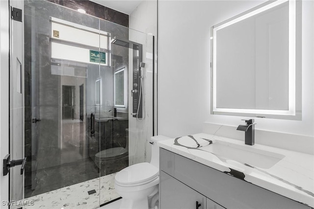 634 Raintree St E, Lehigh Acres, FL 33974 - full bathroom with toilet, a stall shower, and vanity