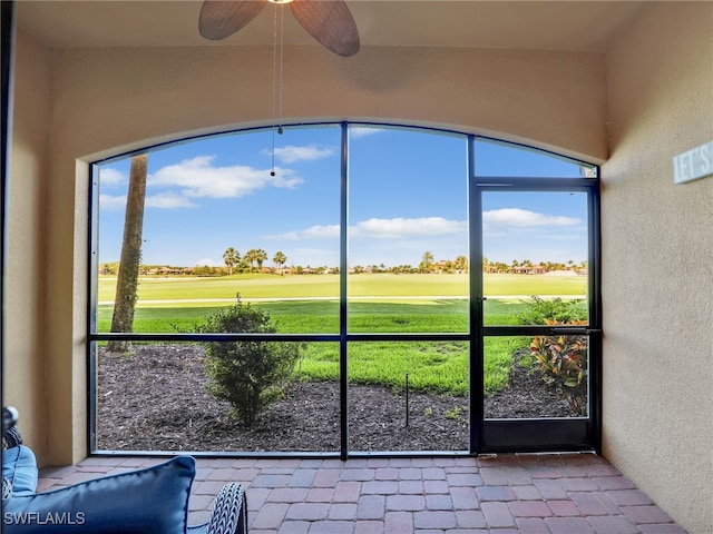 17961 Bonita National Blvd Unit 514, Bonita Springs, FL 34135 - sunroom / solarium featuring view of golf course, ceiling fan, and plenty of natural light