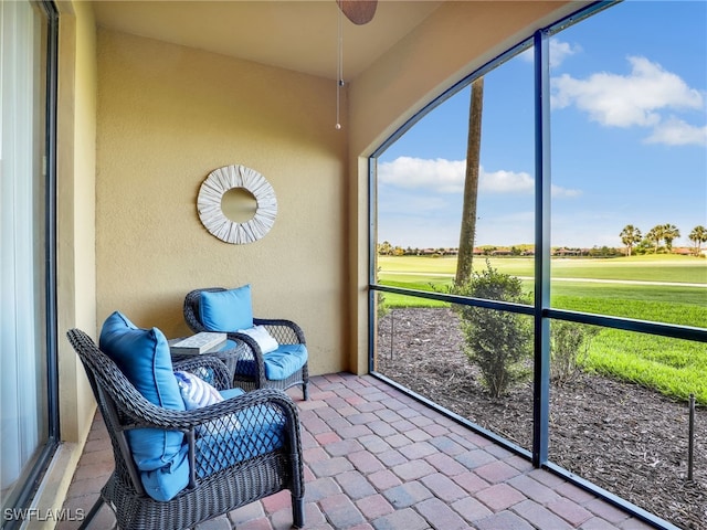 17961 Bonita National Blvd Unit 514, Bonita Springs, FL 34135 - sunroom with view of golf course, plenty of natural light, and a ceiling fan