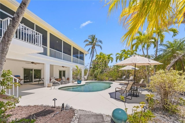3008 Turtle Gait Ln, Sanibel, FL 33957 - outdoor pool featuring ceiling fan, a patio area, and a sunroom