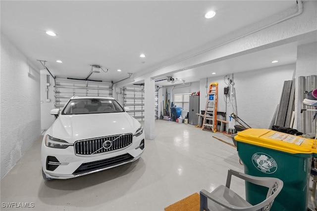 3008 Turtle Gait Ln, Sanibel, FL 33957 - garage featuring a textured wall, recessed lighting, and a garage door opener