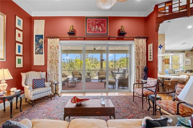 3008 Turtle Gait Ln, Sanibel, FL 33957 - living area with wood finished floors, crown molding, and baseboards
