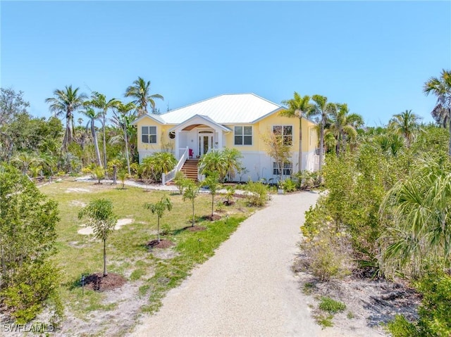 3008 Turtle Gait Ln, Sanibel, FL 33957 - single story home featuring a front lawn