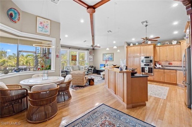 3008 Turtle Gait Ln, Sanibel, FL 33957 - kitchen with ceiling fan, stainless steel appliances, open floor plan, light wood-style flooring, and recessed lighting