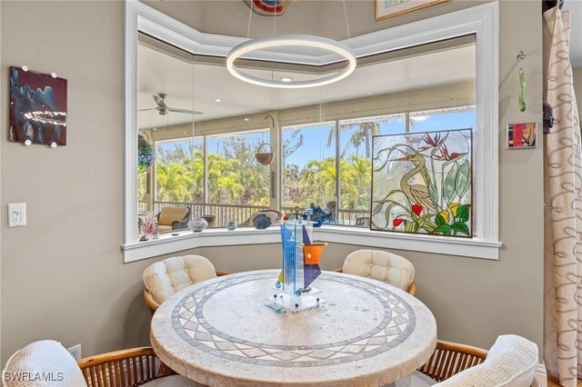 3008 Turtle Gait Ln, Sanibel, FL 33957 - dining space featuring baseboards, healthy amount of natural light, and a ceiling fan