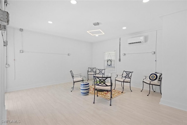 3008 Turtle Gait Ln, Sanibel, FL 33957 - living area with an AC wall unit, recessed lighting, and baseboards