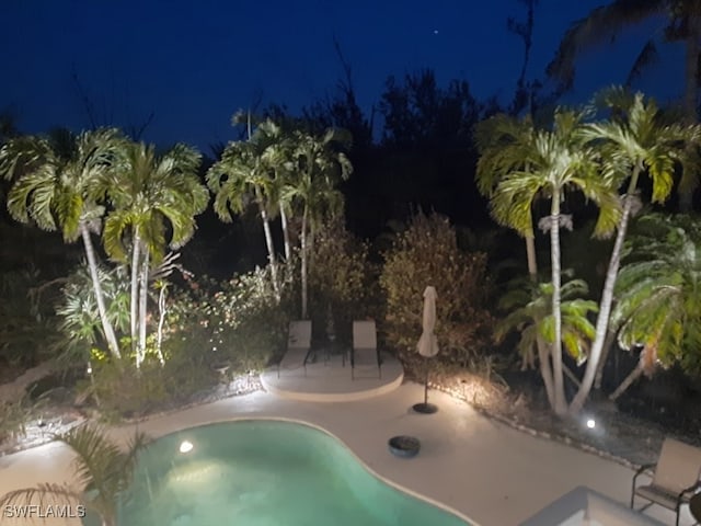 3008 Turtle Gait Ln, Sanibel, FL 33957 - pool at twilight with a patio area and a hot tub
