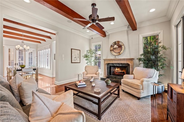 1419 Hemingway Pl, Naples, FL 34103 - living room featuring wood-type flooring, beamed ceiling, a chandelier, baseboards, and healthy amount of natural light