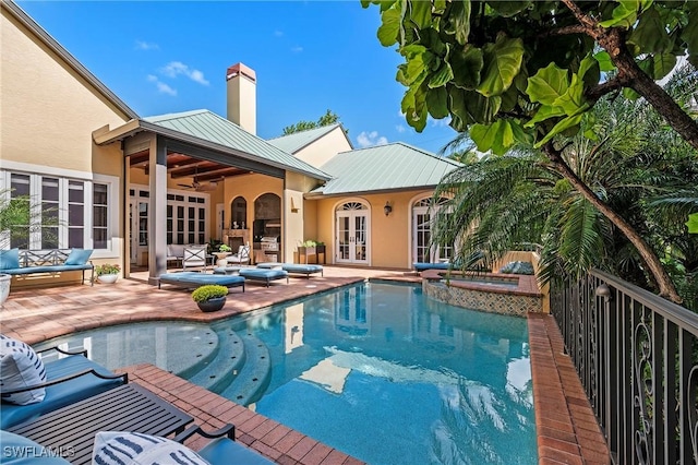 1419 Hemingway Pl, Naples, FL 34103 - view of swimming pool featuring french doors, an outdoor living space, a patio area, a ceiling fan, and a pool with connected hot tub