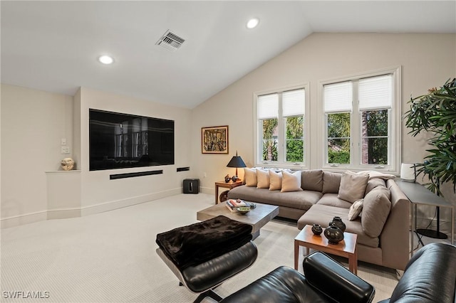 1419 Hemingway Pl, Naples, FL 34103 - living area featuring vaulted ceiling, recessed lighting, and light carpet
