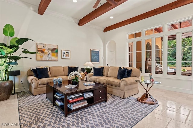 1419 Hemingway Pl, Naples, FL 34103 - living room with beam ceiling, stone tile flooring, arched walkways, recessed lighting, and baseboards