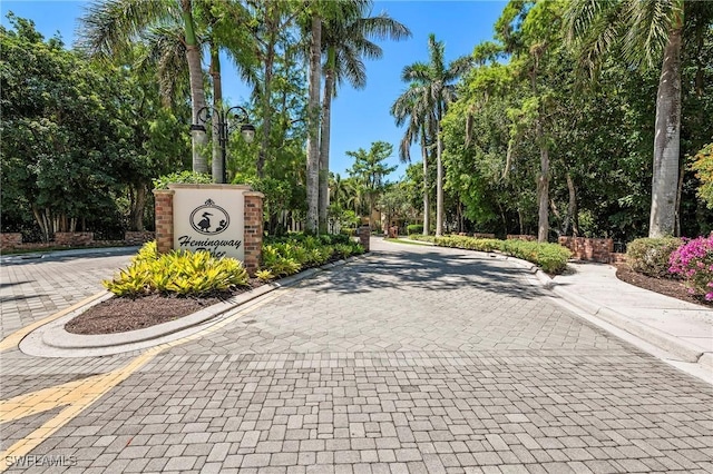 1419 Hemingway Pl, Naples, FL 34103 - view of street featuring curbs and view of wooded area