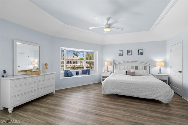 2005 SE 21st St, Cape Coral, FL 33990 - bedroom featuring a raised ceiling, wood finished floors, baseboards, and a ceiling fan