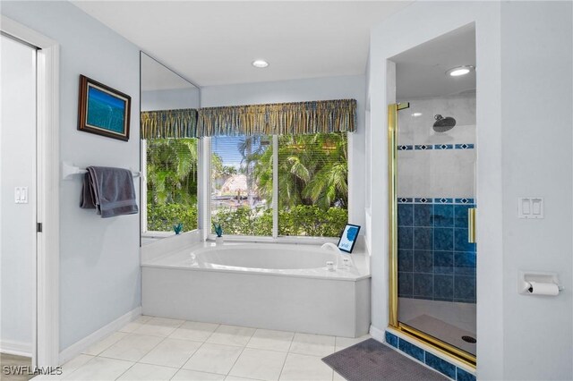 2005 SE 21st St, Cape Coral, FL 33990 - full bath with a stall shower, a bath, tile patterned floors, and baseboards