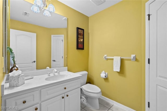 2005 SE 21st St, Cape Coral, FL 33990 - bathroom featuring tile patterned flooring, toilet, vanity, baseboards, and a chandelier