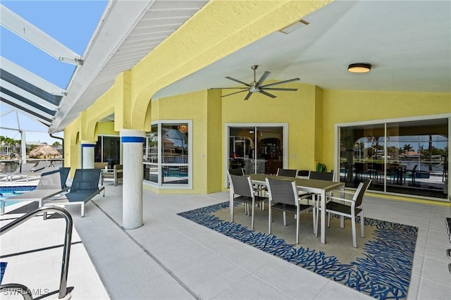 2005 SE 21st St, Cape Coral, FL 33990 - view of patio / terrace featuring an outdoor pool, a ceiling fan, glass enclosure, and outdoor dining space