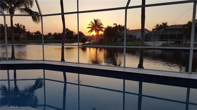 2005 SE 21st St, Cape Coral, FL 33990 - pool at dusk featuring a water view